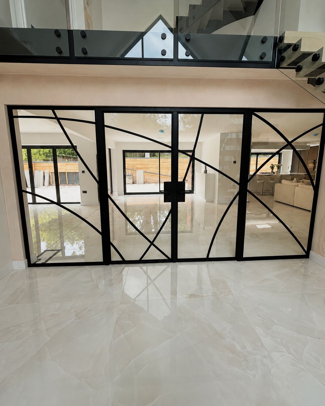 Bespoke internal screen with curved glazing bar pattern