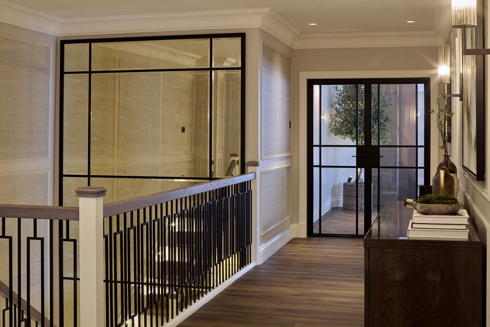 Internal steel doors and an antique mirrored steel screen on a landing